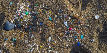 Micro plastics mixed in the sand of the beach